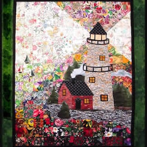 May include: A colorful quilt depicting a lighthouse with a small house in front of it. The lighthouse is made of stone and has a white roof. The house is red with a black roof. The background is a patchwork of colorful fabric.