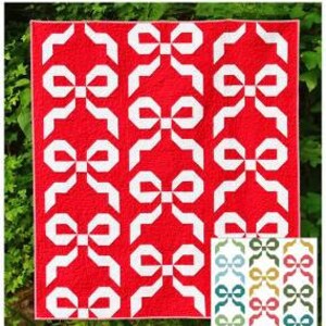 May include: A quilt pattern called "Festive Bows" by Meadow Mist Designs. The pattern features a red background with white bow shapes. The pattern is available in throw and queen sizes and in multi-fabric and two-tone versions.