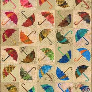May include: A quilt with a pattern of colorful umbrellas on a beige background. The umbrellas are made of different fabrics and have a variety of designs.