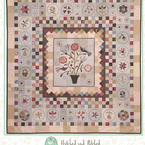 May include: A quilt pattern titled "Nature's Journey" featuring a floral design in the centre and a border of various patchwork squares and circles. The pattern is from Hatched and Patched, a company that sells quilting patterns.