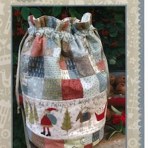 May include: A patchwork fabric bag with a drawstring closure. The bag is decorated with a red, white, and green embroidered design of a snowman, reindeer, and trees. The text "All is Merry and bright of night" is embroidered on the bag.