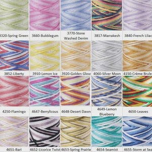 May include: A collection of colorful yarn skeins, each with a unique blend of hues. The skeins are labeled with names like "Spring Green," "Bubblegum," and "French Lilac." The image showcases a variety of colors, including blues, pinks, yellows, and greens.
