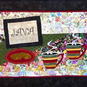 May include: A colorful patchwork quilt with a framed sign that says "JAVA" and two mugs of coffee with steam rising from them.