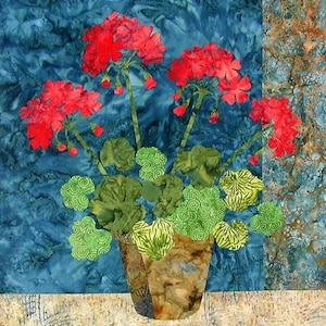 May include: A terracotta pot filled with a vibrant green plant with red geranium flowers. The pot is sitting on a light beige surface with a blue and white patterned background.