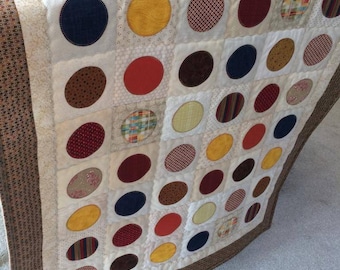 Colcha de retalhos tradicional com manchas coloridas