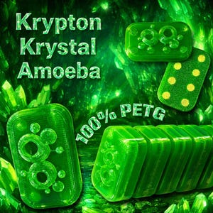 May include: Several green, rectangular objects with rounded corners, displaying a design of interconnected circles and dots. The text "Krypton Krystal Amoeba" and "100% PETG" are visible. The objects are set against a green, crystalline backdrop.