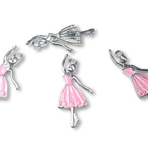 May include: Four silver ballerina charms with pink dresses and silver detailing. The charms are ideal for adding a touch of whimsy to jewellery or crafts.