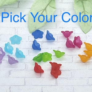 May include: Assortment of flower-shaped beads in various colors, including blue, green, purple, pink, orange, and red.  Pick Your Color.