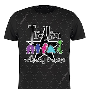 May include: Black t-shirt with a white star and the text "Trollin' with my homies".  The star has five points and is filled in black.  There are five small, colorful cartoon trolls inside the star.