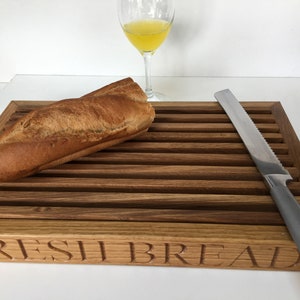 Bread cutting board, Crumb catcher style, Available in many woods, Oak, Beech cherry or Walnut. Customisable bread cutting board. image 1