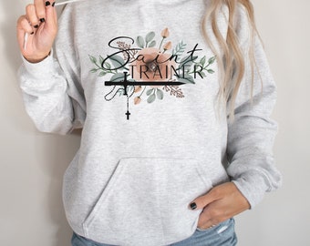 Saint Trainer, mujeres católicas, madre católica, maestra católica, maestra cristiana, maestra de religión, regalo católico, sudadera Crewneck