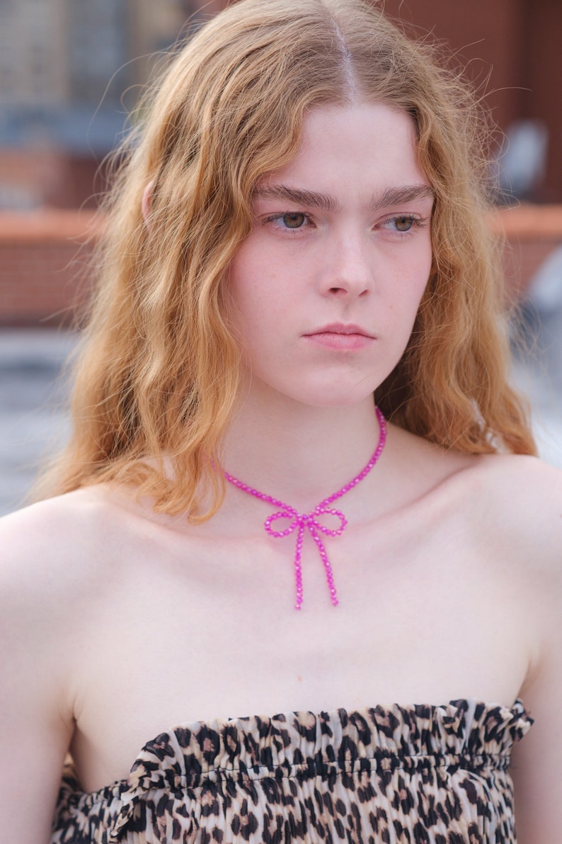 fuchsia beaded bow necklace