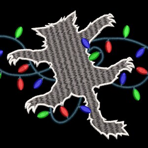 May include: A gray cat silhouette tangled in a string of Christmas lights with red, green, and blue bulbs.