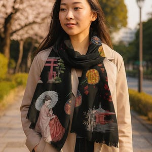The Pashmina scarf is a lightweight, semi-sheer, black wrap with an elegant, Japanese Geisha-inspired design