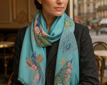 The Pashmina Scarf is a semi-sheer, lightweight wrap or shawl featuring an aqua blue peacock design
