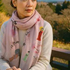 The Chic Pashmina Scarf is a semi-sheer, lightweight, pink accessory with an elegant Japanese geisha-inspired design