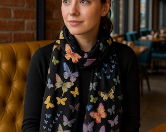 The Butterfly Pashmina is a semi-sheer, lightweight black scarf, ideal for a vacation wrap