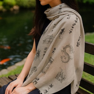 Pashmina is a semi-sheer, lightweight brown scarf with an elegant Japanese Geisha design