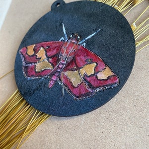 Maroon and Gold Moth on Black wooden ornament / wall-hanging image 3