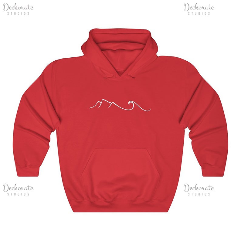 May include: A red hooded sweatshirt with a white mountain and wave design. The sweatshirt has a front pocket and a drawstring hood. The design is a simple line drawing of mountains and ocean waves.