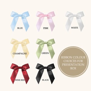 A grid of seven satin bows in different colors: blue, pink, white, champagne, green, wine red, and black.