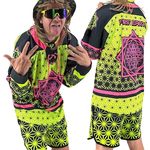 May include: A neon green and black jersey and shorts set with a geometric pattern and pink accents. The jersey has the text "FIRST EARTH" on the back. The set includes a long-sleeved jersey and matching shorts.
