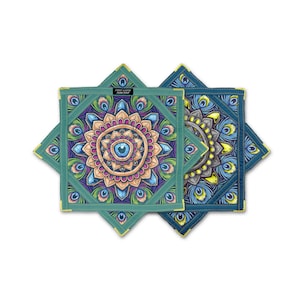 May include: Two square decorative cloths with a peacock feather design. The cloths are teal and navy blue with yellow trim. The center of each cloth features a mandala design with the text "First Earth Flow Star".
