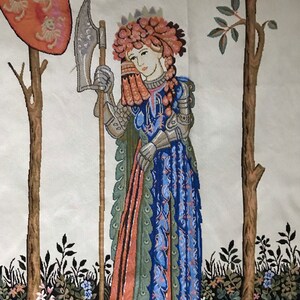 May include: A tapestry depicting a woman in armor holding a large axe. She is wearing a crown of flowers and a blue and green dress. The tapestry is set against a background of trees and flowers.