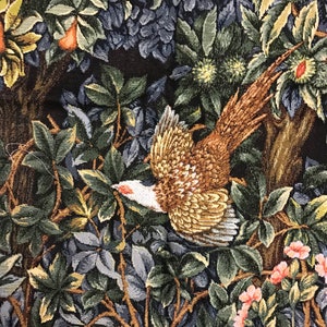 May include: A tapestry featuring a pheasant in flight, surrounded by lush green and blue foliage. The pheasant is brown, gold, and white with a long tail. The background is a dark brown.