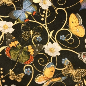 May include: Black fabric with a gold floral pattern and colorful butterflies. The butterflies are embroidered with intricate details and have a variety of colors, including blue, yellow, and green.