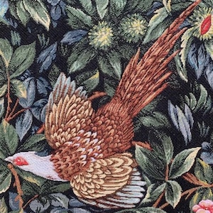 May include: A tapestry featuring a brown and white pheasant with a long tail, flying through a dark green and blue floral pattern.