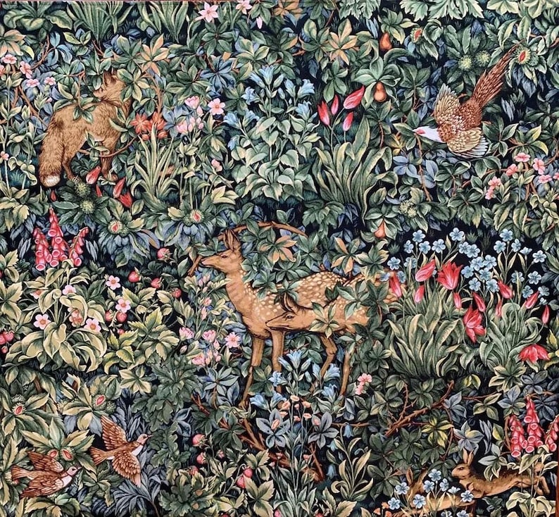 May include: A tapestry featuring a detailed depiction of a forest scene with a variety of flora and fauna. The tapestry includes a fox, two deer, a bird, and a rabbit, all woven into the intricate design. The tapestry is a rich green and brown color with pops of red and blue.