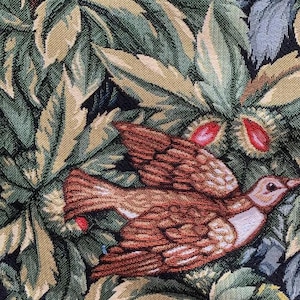 May include: A tapestry featuring a brown bird with white markings flying through a forest scene. The background is a dark green and brown tapestry with leaves and flowers.