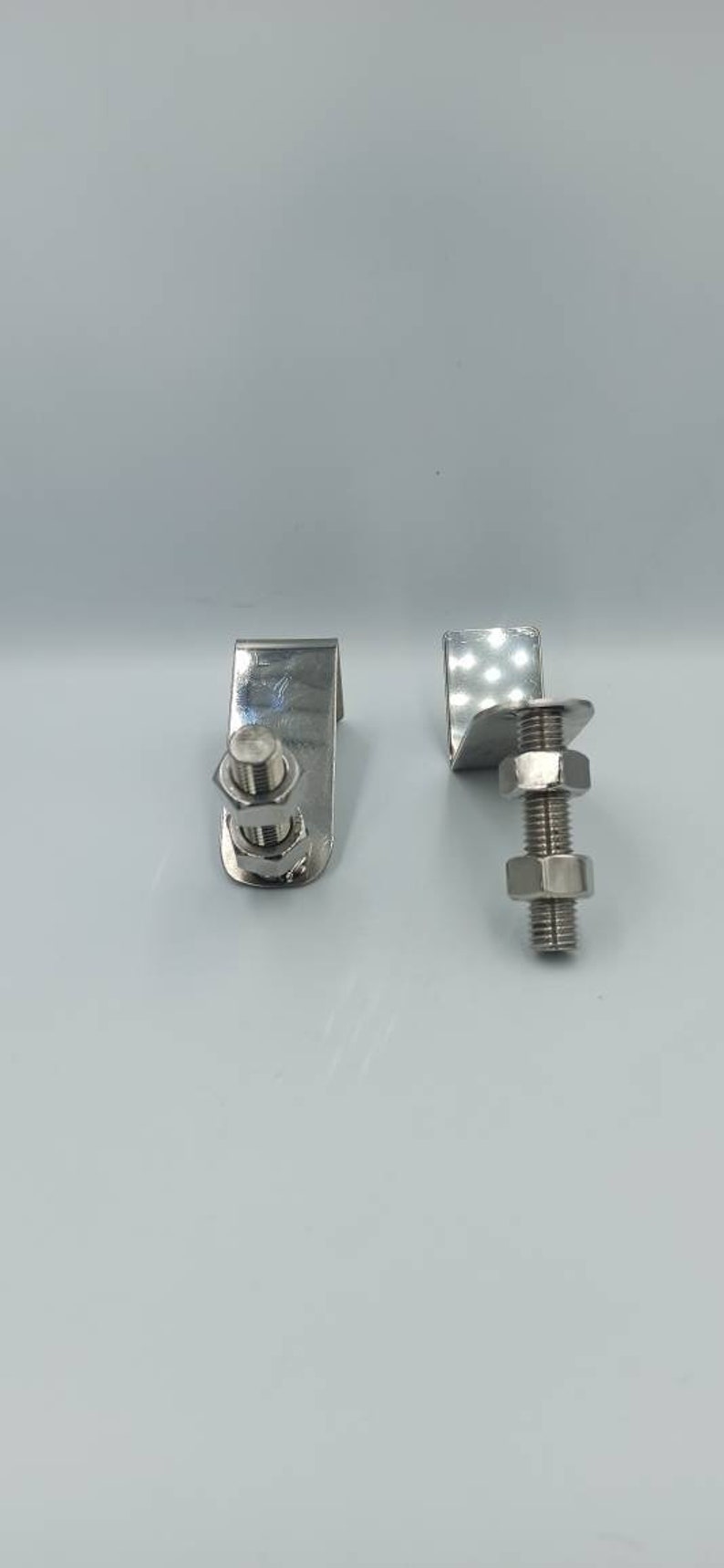 BOOKENDS Especially for medium size books. Handmade decorative metal craft with bolds and adjustable nuts *INOX 2 pieces. 13cm\u00d7 13cm