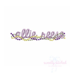 May include: Purple and yellow beaded garland with the name "allie reese" embroidered in purple cursive.