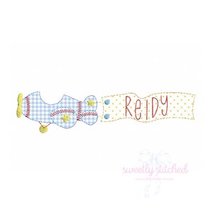 May include: Embroidered design of a blue and white gingham airplane pulling a banner that says "Reidy".