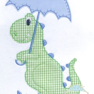 May include: A green and white gingham dinosaur wearing blue rain boots and holding a blue umbrella. There are three raindrops on the ground.