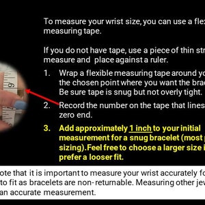 May include: Image with instructions on how to measure wrist size for bracelets. Includes a hand with a measuring tape, and text explaining the process: wrap tape, record measurement, and add 1 inch for a snug fit.