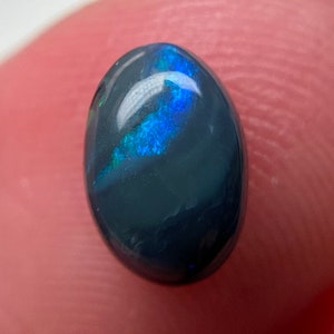 0.7 ct Natural Australian Solid Black Opal Oval Cabochon Blue Flash