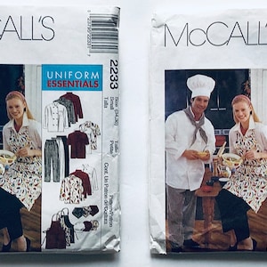May include: Two sewing patterns for chef uniforms, one for a small size and one for a large size. The patterns include a chef coat, pants, and an apron. The patterns are from McCall's and are labeled "Uniform Essentials".
