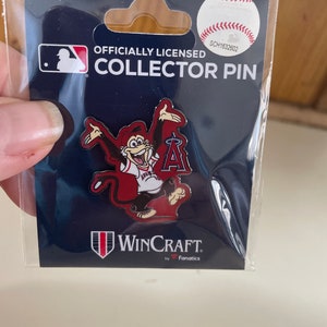 May include: Officially Licensed Collector Pin featuring a cartoon monkey wearing a red baseball uniform with the letter "A" on the front. The monkey is holding a baseball bat and is wearing a red hat. The pin is made by WinCraft by Fanatics.