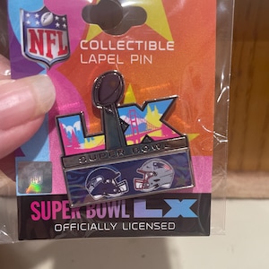 May include: A collectible NFL Super Bowl LX lapel pin. The pin features the Super Bowl LX logo, football helmets, and the NFL logo. The pin is on a colorful card with the words "COLLECTIBLE LAPEL PIN" and "OFFICIALLY LICENSED".