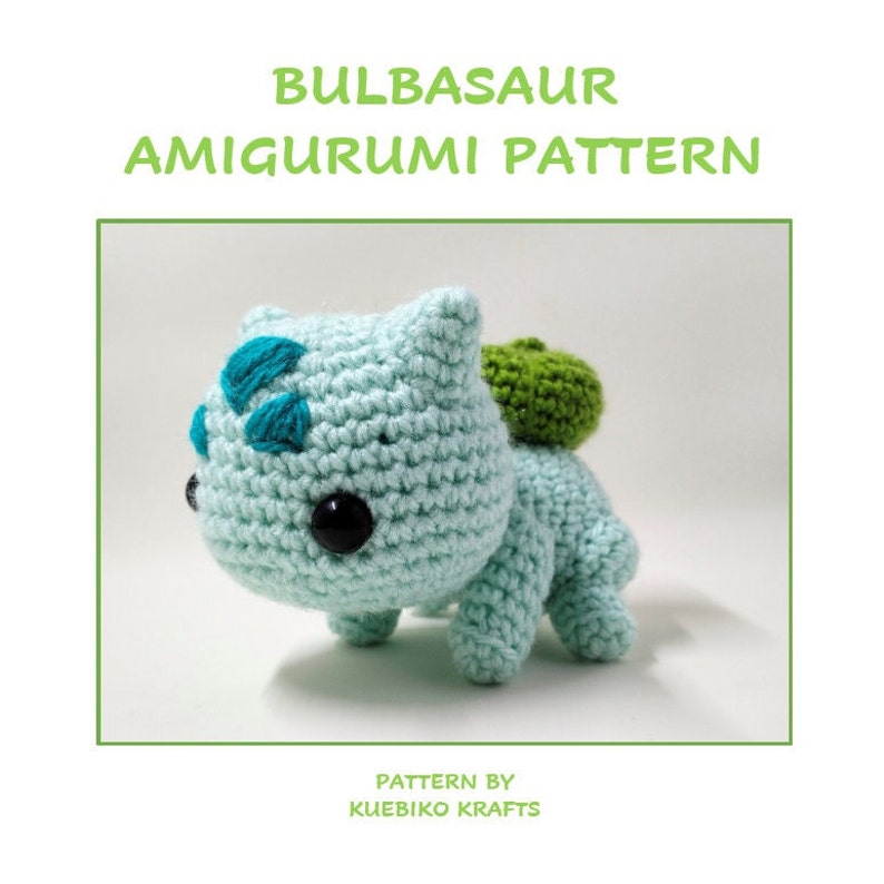 May include: A crochet amigurumi pattern for a Bulbasaur Pokemon. The pattern is by Kuebiko Krafts. The Bulbasaur is green with a blue and green flower on its head.