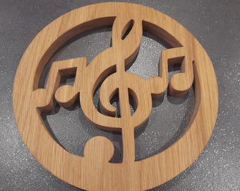 Treble clef, musical notes, solid wood trivet, handmade creation. Cut with a scroll saw.