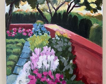 May include: An original oil painting of a garden scene. The artwork depicts a red wall, a stone path, and a variety of colorful flowers in shades of pink, white, blue, and orange. The background features trees and a sunset sky.