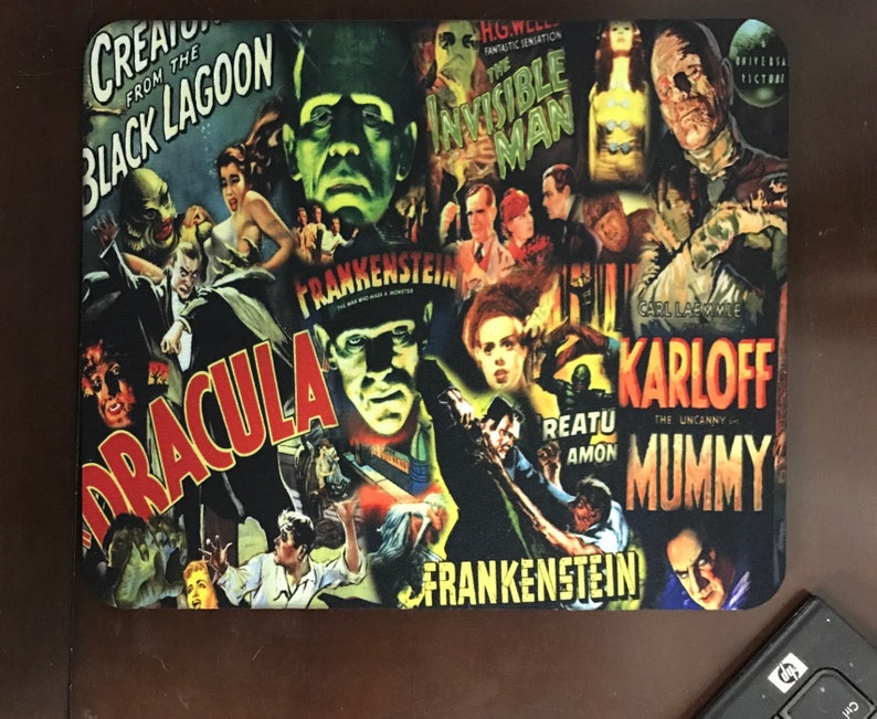 May include: A colorful collage of classic horror movie posters featuring iconic characters like Dracula, Frankenstein, The Mummy, and The Invisible Man. The posters are arranged in a chaotic and visually appealing way, creating a sense of excitement and nostalgia.