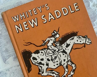Vintage childrens book | Whitey's New Saddle by Glen Rounds | midcentury western cowboy theme orange hardcover with horse illustration