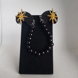 Clip per cardigan a forma di rene atomico