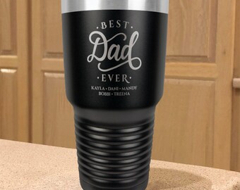 May include: Black stainless steel tumbler with a white inscription that reads "Best Dad Ever" and includes the names Kayla, Dani, Mandy, Bobbi, and Treena.