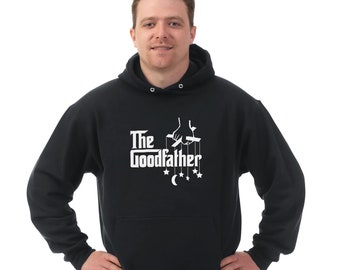May include: Black hooded sweatshirt with a white graphic of a hand holding strings attached to stars and a crescent moon. The text "The Godfather" is printed below the graphic.